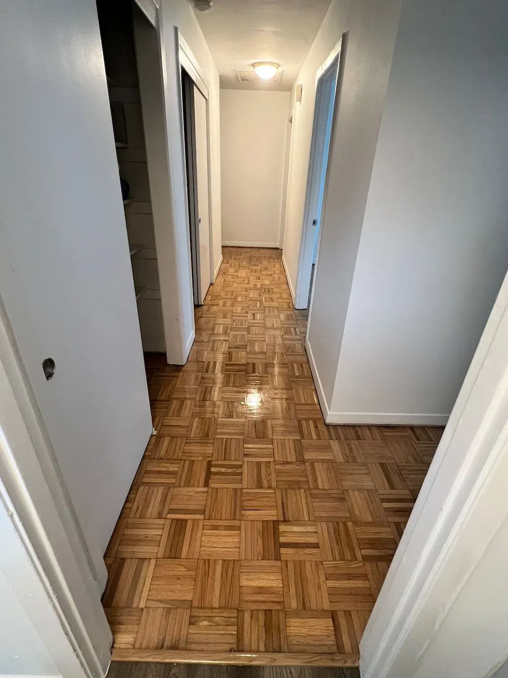 A hallway with restored flooring